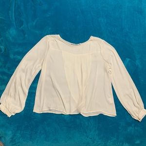 Long sleeved cream blouse